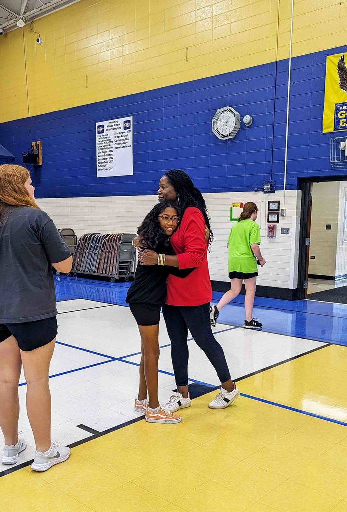 A Simmons Middle School student gets a hug from the Rachel's Challenge presenter