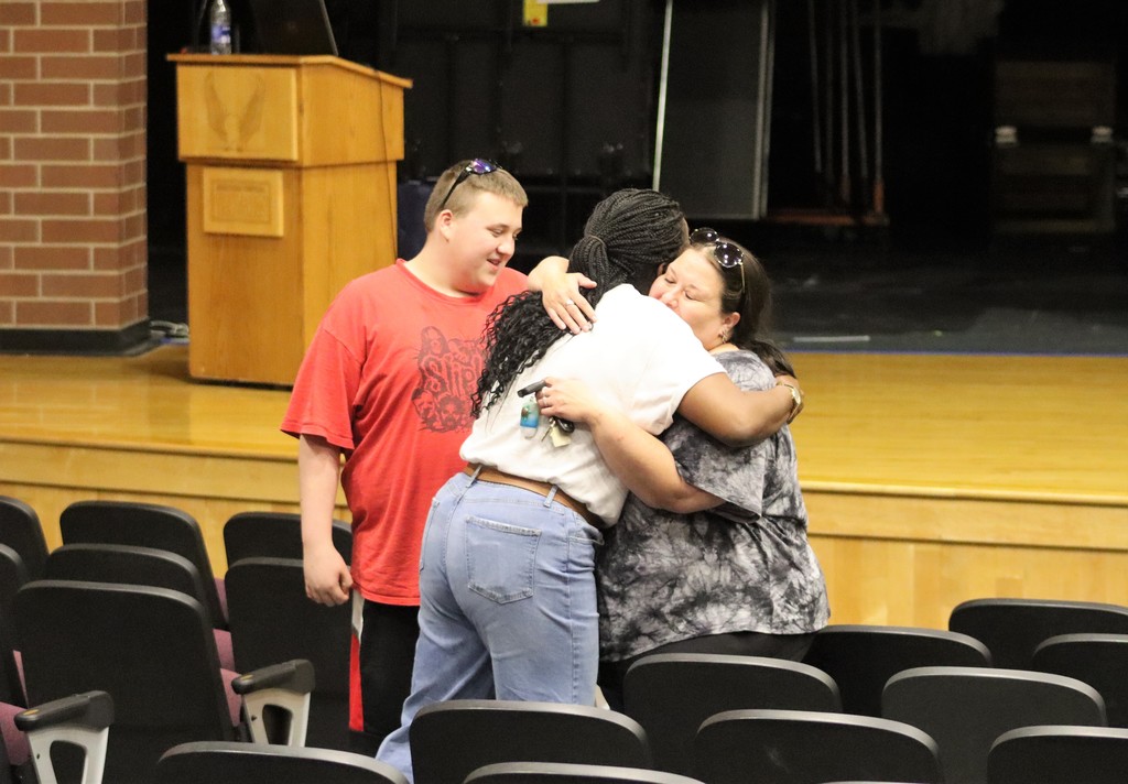 Veda Tucker hugs a parent at the Rachel's Challenge community presentation